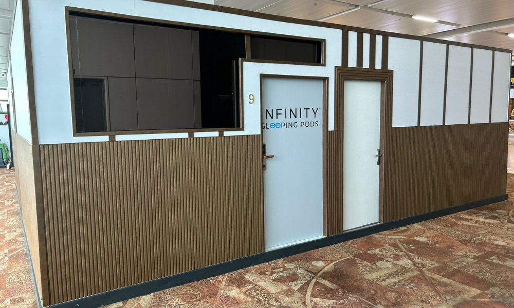 Transit passengers using sleeping pods at Delhi Airport Terminal 3 for relaxation during layovers